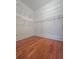 Walk-in closet with hardwood floors and metal shelving for organized storage solutions at 3898 Ridge Rd, Buford, GA 30519