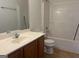 Bathroom featuring a tub, toilet, vanity, and a large mirror at 4870 Hairston Park Sq, Stone Mountain, GA 30083