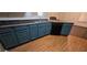 Kitchen featuring custom blue cabinetry, a black dishwasher, and hardwood floors at 4870 Hairston Park Sq, Stone Mountain, GA 30083