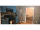 Kitchen featuring stainless steel appliances, blue cabinetry, and a view into another room at 4870 Hairston Park Sq, Stone Mountain, GA 30083