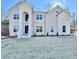 Two-story house with brick facade, arched entryway, and landscaped lawn at 179 Basie Ct, Fairburn, GA 30213