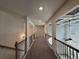 Upper hallway with wood railing at 179 Basie Ct, Fairburn, GA 30213