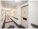 Clean and well-lit hallway with carpeted floors and neutral walls at 300 Johnson Ferry Ne Rd # A203, Sandy Springs, GA 30328