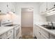 White kitchen features ample counter space and a view to the dining area at 300 Johnson Ferry Ne Rd # A203, Sandy Springs, GA 30328