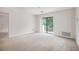 Spacious living room with sliding glass doors leading to balcony at 300 Johnson Ferry Ne Rd # A203, Sandy Springs, GA 30328