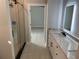 Bathroom with double vanity, marble counters, and walk-in shower at 408 Autry St, Norcross, GA 30071