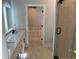 Bathroom with double vanity, marble counters and walk-in shower at 408 Autry St, Norcross, GA 30071