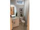 Small bathroom with white vanity and marble countertop at 408 Autry St, Norcross, GA 30071