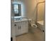 Bathroom with single vanity, quartz countertop, and tub shower combo at 408 Autry St, Norcross, GA 30071