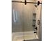 Modern bathroom with soaking tub, glass shower, and black accents at 408 Autry St, Norcross, GA 30071