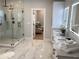 Luxurious bathroom with marble floors, double vanity, and large shower at 408 Autry St, Norcross, GA 30071