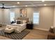 Spacious bedroom with hardwood floors, large windows, and ceiling fan at 408 Autry St, Norcross, GA 30071