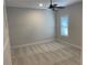 Bright bedroom with ceiling fan and neutral carpeting at 408 Autry St, Norcross, GA 30071