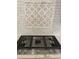 Stainless steel cooktop with patterned tile backsplash at 408 Autry St, Norcross, GA 30071