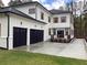 Three-car garage and white house with deck at 408 Autry St, Norcross, GA 30071