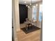 Modern home office with dark accent wall and hardwood floors at 408 Autry St, Norcross, GA 30071