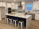 Modern kitchen with white cabinets, large island, and stainless steel appliances at 408 Autry St, Norcross, GA 30071