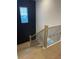 Elegant staircase with light wood treads and black metal railing at 408 Autry St, Norcross, GA 30071