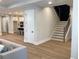 Modern staircase with dark accent wall at 408 Autry St, Norcross, GA 30071