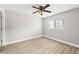 Bright bedroom with ceiling fan and vinyl plank flooring at 803 New Horizon St, Powder Springs, GA 30127