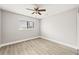 Spacious bedroom with ceiling fan and large window at 803 New Horizon St, Powder Springs, GA 30127