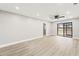 Light-filled living area featuring vinyl flooring and sliding glass doors at 803 New Horizon St, Powder Springs, GA 30127