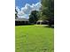 Large backyard with detached garage and green space at 5595 Stagecoach Rd, Rex, GA 30273