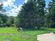 Fenced dog run and grassy area in backyard at 5595 Stagecoach Rd, Rex, GA 30273