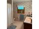 Retro bathroom with pink tile and vintage vanity at 5595 Stagecoach Rd, Rex, GA 30273