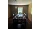 Formal dining room with a wood table and chairs, hardwood floors at 5595 Stagecoach Rd, Rex, GA 30273