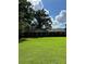 Brick ranch house with a large front yard and mature trees at 5595 Stagecoach Rd, Rex, GA 30273