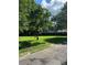 Brick house with covered porch and spacious yard at 5595 Stagecoach Rd, Rex, GA 30273