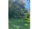 Ranch house nestled among lush trees and green lawn at 5595 Stagecoach Rd, Rex, GA 30273
