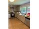 Updated kitchen with stainless steel appliances and light gray cabinets at 5595 Stagecoach Rd, Rex, GA 30273