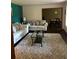 Living room with light beige sofas and a contemporary glass coffee table at 5595 Stagecoach Rd, Rex, GA 30273