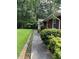 Sidewalk leading to house entrance, landscaping visible at 5595 Stagecoach Rd, Rex, GA 30273