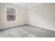 Bright bedroom featuring grey carpet and a large window at 279 Lewis Way, Canton, GA 30115