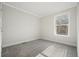Bright bedroom with gray carpet and a window at 279 Lewis Way, Canton, GA 30115