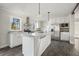 Modern kitchen with white cabinets and stainless steel appliances at 279 Lewis Way, Canton, GA 30115