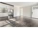 Open concept living room and kitchen with hardwood floors at 279 Lewis Way, Canton, GA 30115