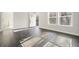 Bright living room featuring dark hardwood floors at 279 Lewis Way, Canton, GA 30115