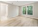 Light-filled bedroom with a view and an ensuite bathroom at 4315 Orchard Park Ct, Stone Mountain, GA 30083
