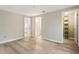 Spacious bedroom with wood-look flooring and closet space at 4315 Orchard Park Ct, Stone Mountain, GA 30083