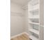 Organized walk-in closet with built-in shelving and ample storage space at 4315 Orchard Park Ct, Stone Mountain, GA 30083