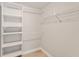 Walk-in closet with built-in shelving and clothing racks, ready for organization at 4315 Orchard Park Ct, Stone Mountain, GA 30083