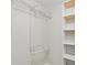 Bright closet featuring white walls, ceiling texture, and shelving for optimal organization and storage space at 4315 Orchard Park Ct, Stone Mountain, GA 30083