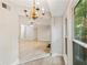 Dining space with chandelier and large windows viewable from the living room and main hall at 4315 Orchard Park Ct, Stone Mountain, GA 30083