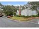 Well-maintained home exterior with lush landscaping and ample parking at 4315 Orchard Park Ct, Stone Mountain, GA 30083