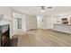 Open concept layout features living area, fireplace, and kitchen with white cabinets at 4315 Orchard Park Ct, Stone Mountain, GA 30083