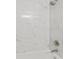 Updated shower with white marble tiles and brushed nickel fixtures at 4315 Orchard Park Ct, Stone Mountain, GA 30083